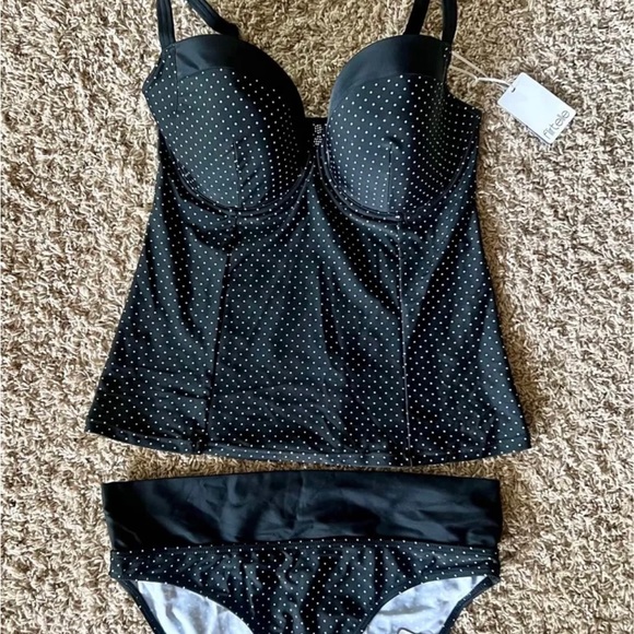 Flirtelle Other - Top is size 32 J with underwire ( Fits like a D or DD)
Bottom is medium